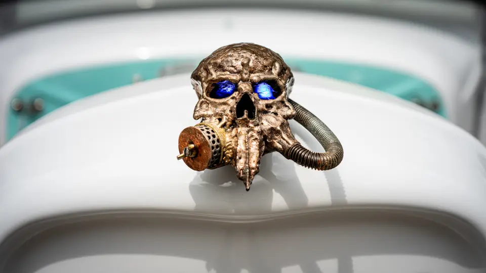 Respirator-skull hood ornament, lit eyes