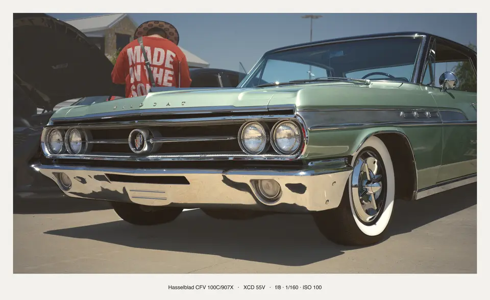 Green Buick, front three-quarter on whitewalls