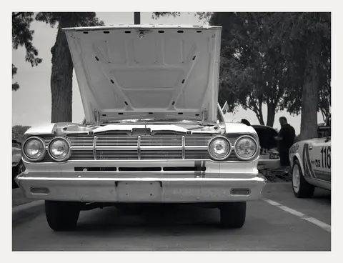Hood up, quad headlamps and grille