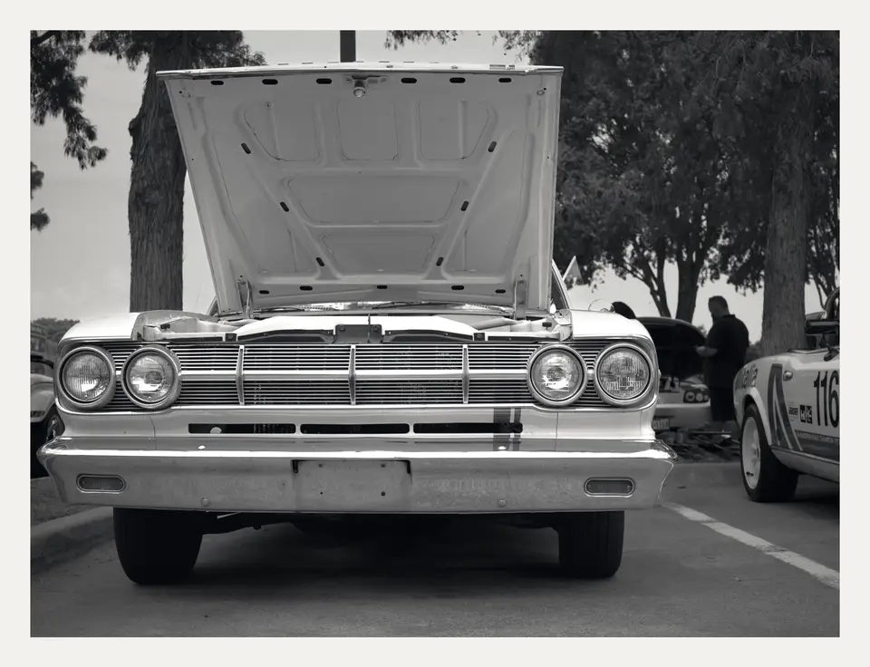 Hood up, quad headlamps and grille