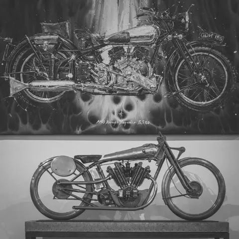 Board-track racer under a painted Brough